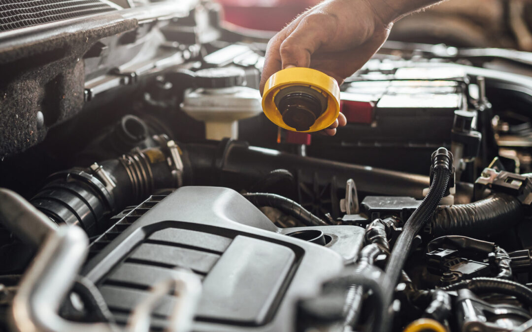 Closeup shot of auto mechanic hands doing car technical inspection in service